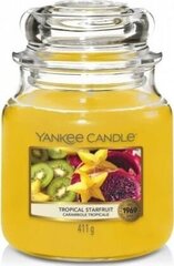 Aromātiskā svece Yankee Candle Tropical Starfruit 411g cena un informācija | Sveces un svečturi | 220.lv